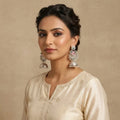 Silver Tone Oxidized Jhumka Earrings With Stone from Saara